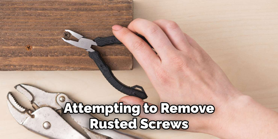 Attempting to Remove Rusted Screws