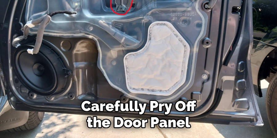 Carefully Pry Off the Door Panel