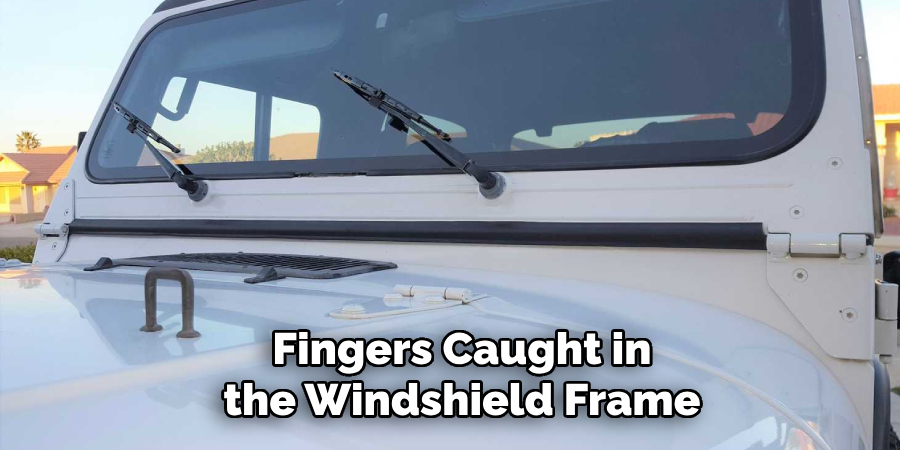 Fingers Caught in the Windshield Frame