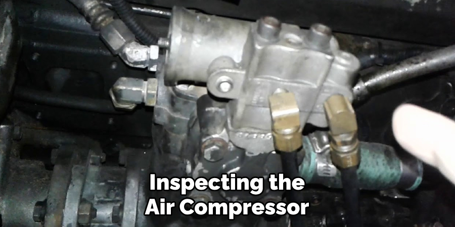 Inspecting the Air Compressor