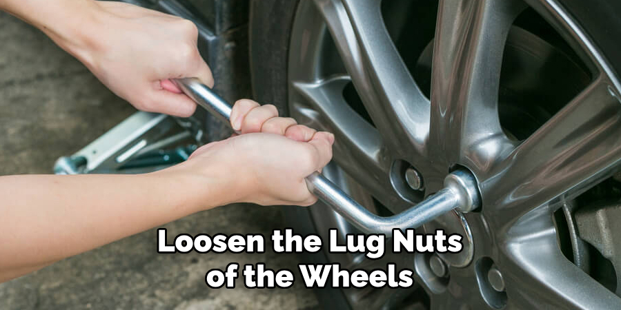 Loosen the Lug Nuts of the Wheels