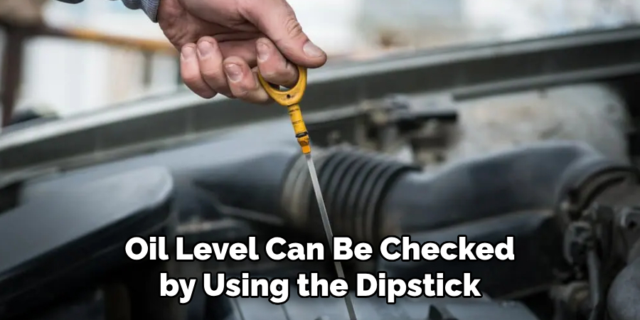 Oil Level Can Be Checked by Using the Dipstick