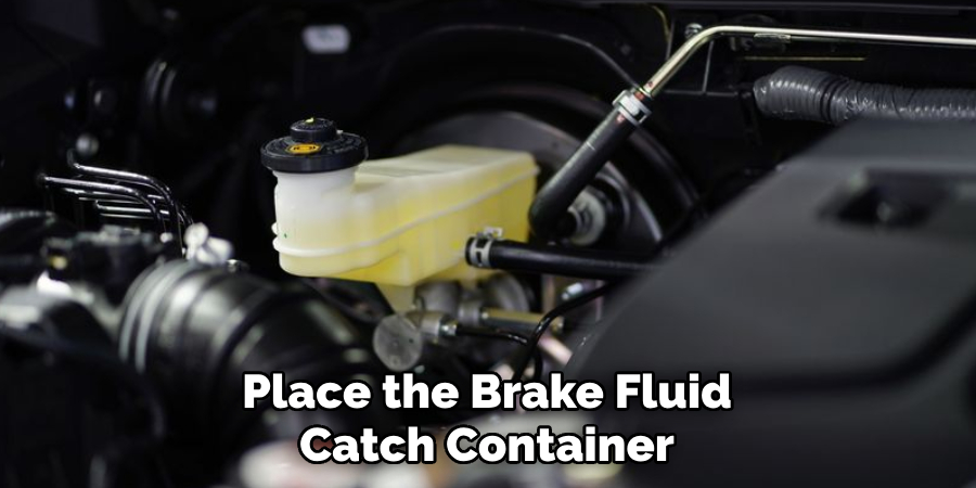 Place the Brake Fluid Catch Container