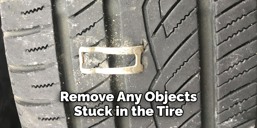 Remove Any Objects Stuck in the Tire