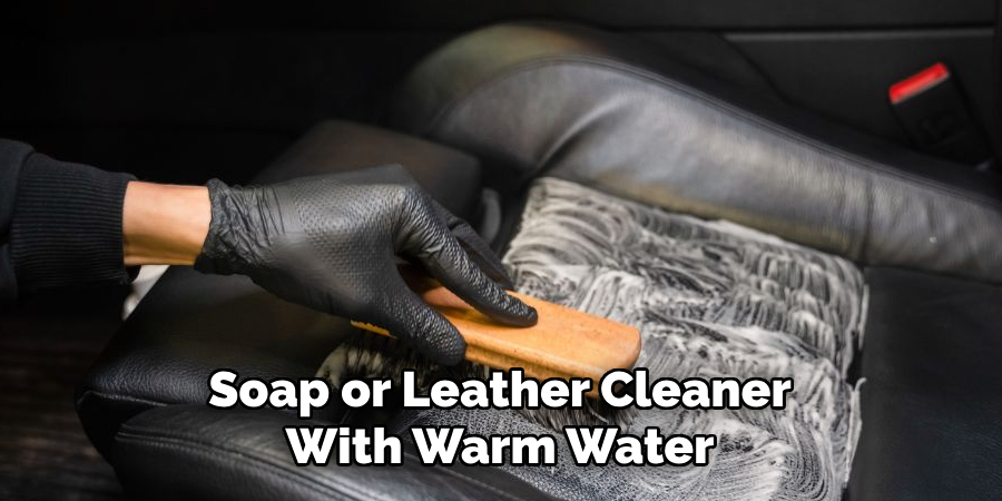 Soap or Leather Cleaner With Warm Water