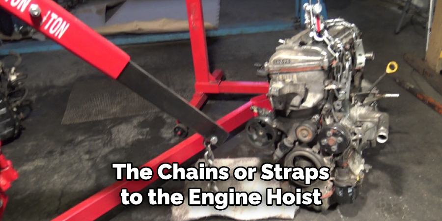 The Chains or Straps to the Engine Hoist