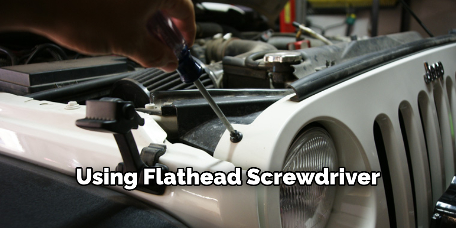 Using a Flathead Screwdriver