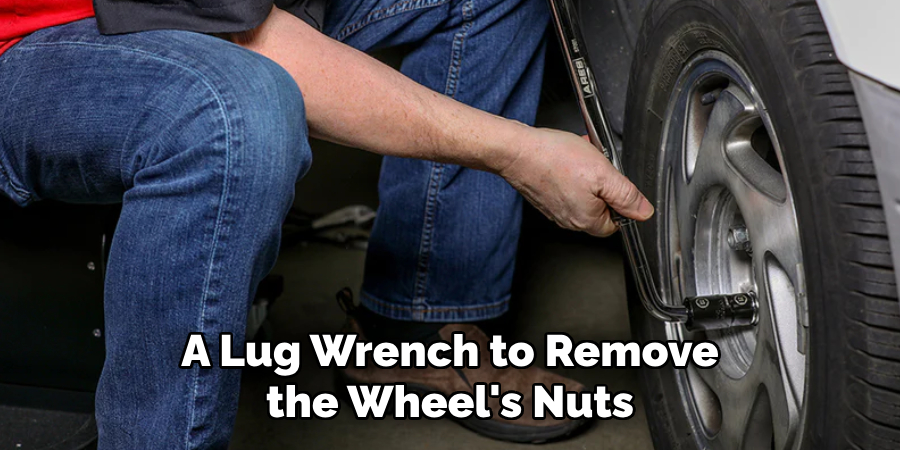 A Lug Wrench to Remove the Wheel's Nuts