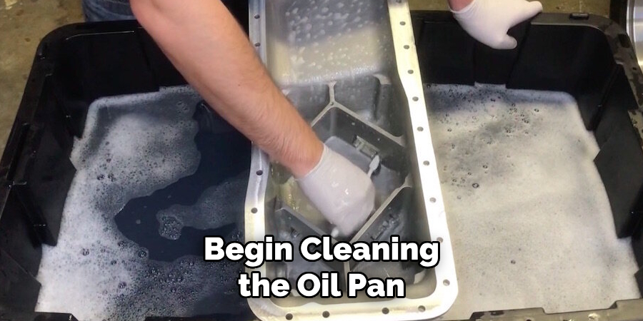 Begin Cleaning the Oil Pan