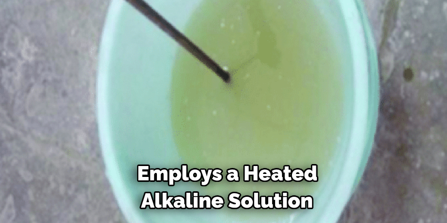 Employs a Heated Alkaline Solution