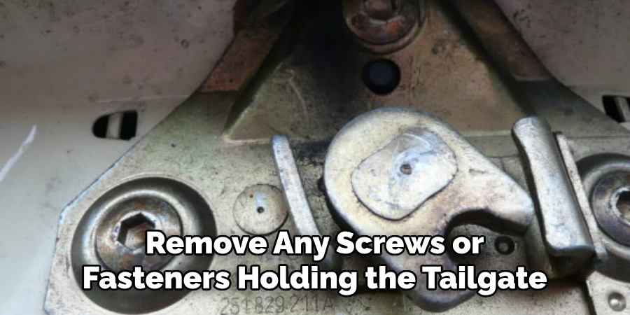 Remove Any Screws or Fasteners Holding the Tailgate