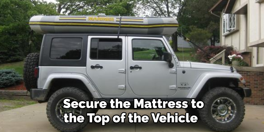 Secure the Mattress to the Top of the Vehicle 