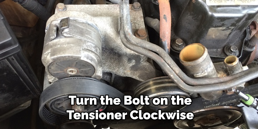 Turn the Bolt on the Tensioner Clockwise