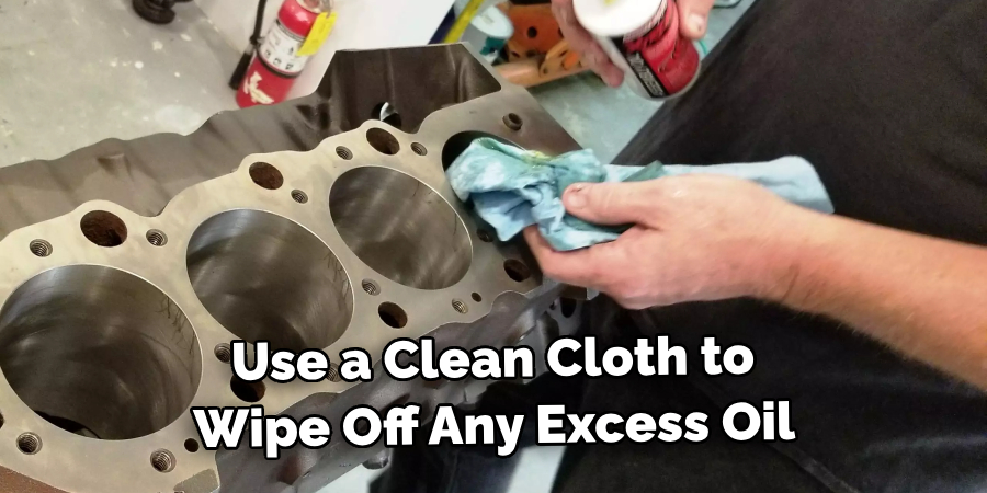 Use a Clean Cloth to Wipe Off Any Excess Oil 