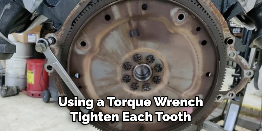 Using a Torque Wrench Tighten Each Tooth